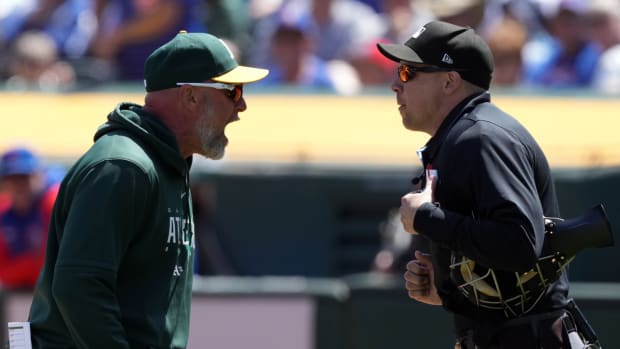 Athletics manager Mark Kotsay yells at umpire Adam Hamari during a game vs. the Cubs in 2023.